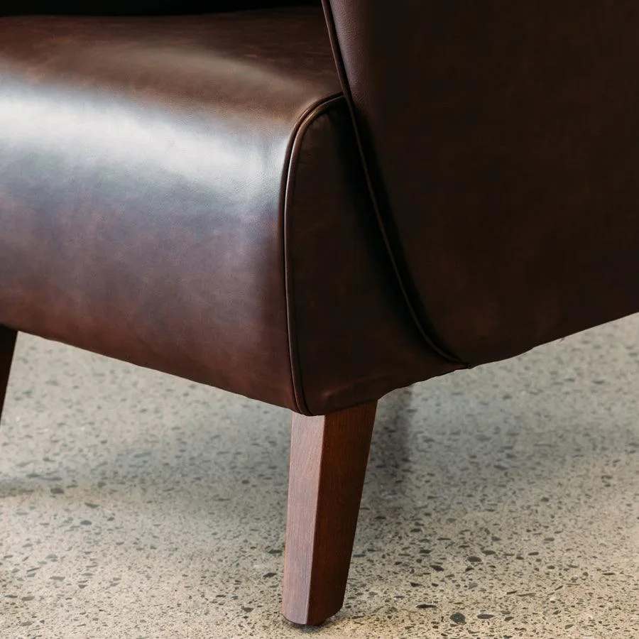 Lily winged leather armchair in settler serge