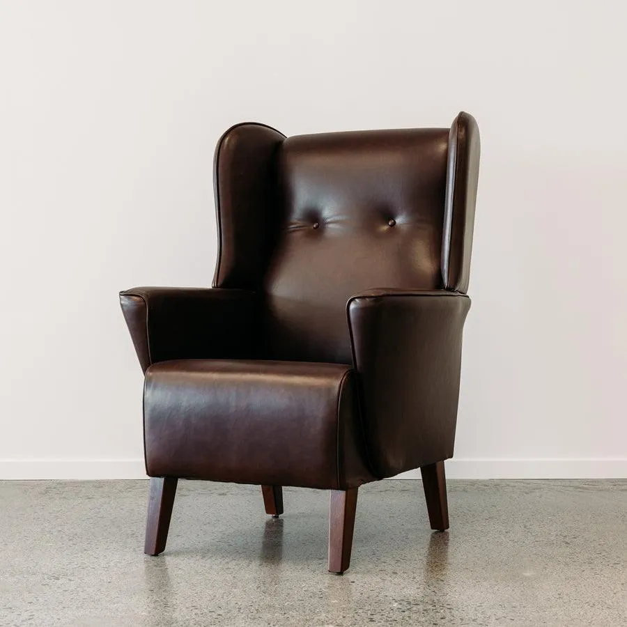 Lily winged leather armchair in settler serge