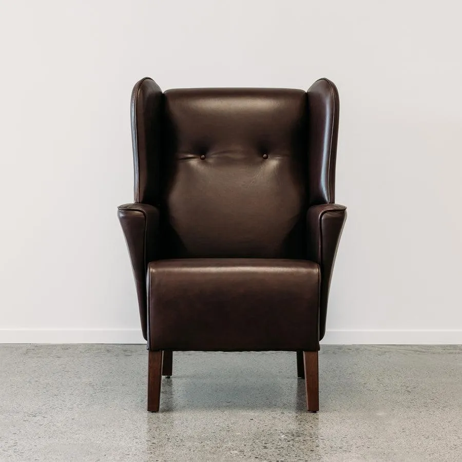 Lily winged leather armchair in settler serge