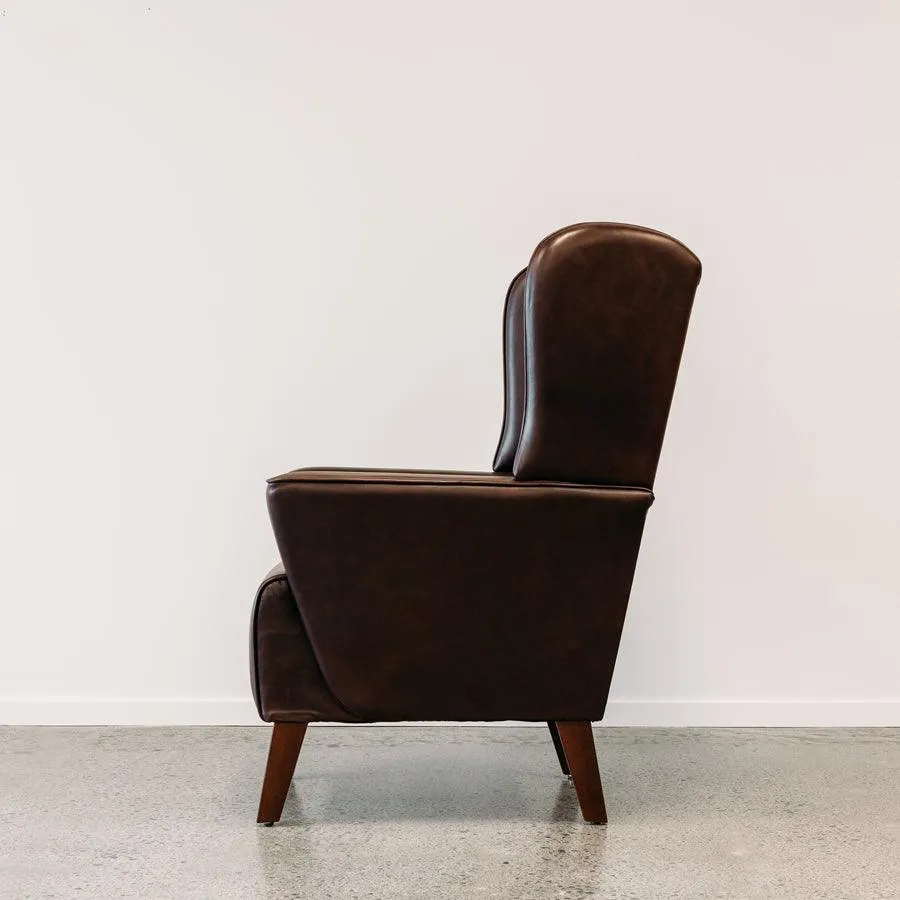 Lily winged leather armchair in settler serge