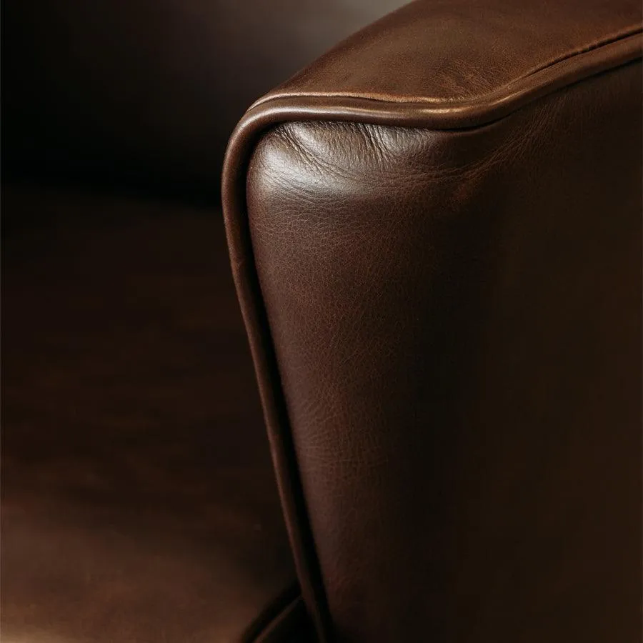 Lily winged leather armchair in settler serge